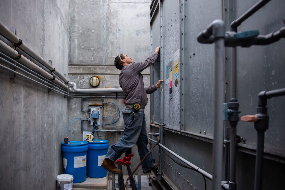 hvac technician working on a machine