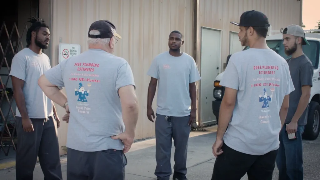 Cass Plumbing team huddle outside of warehouse