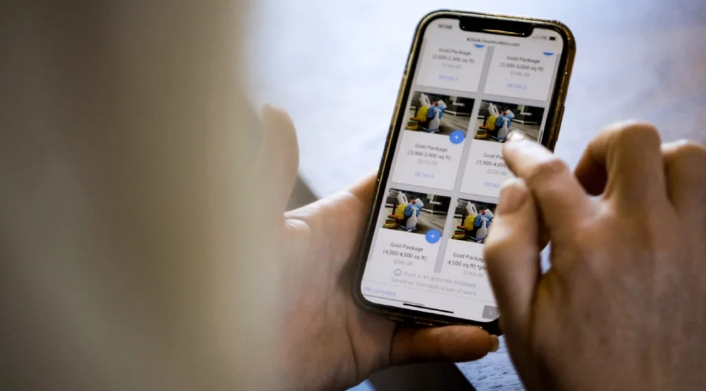 Person using Housecall Pro price book software on mobile device